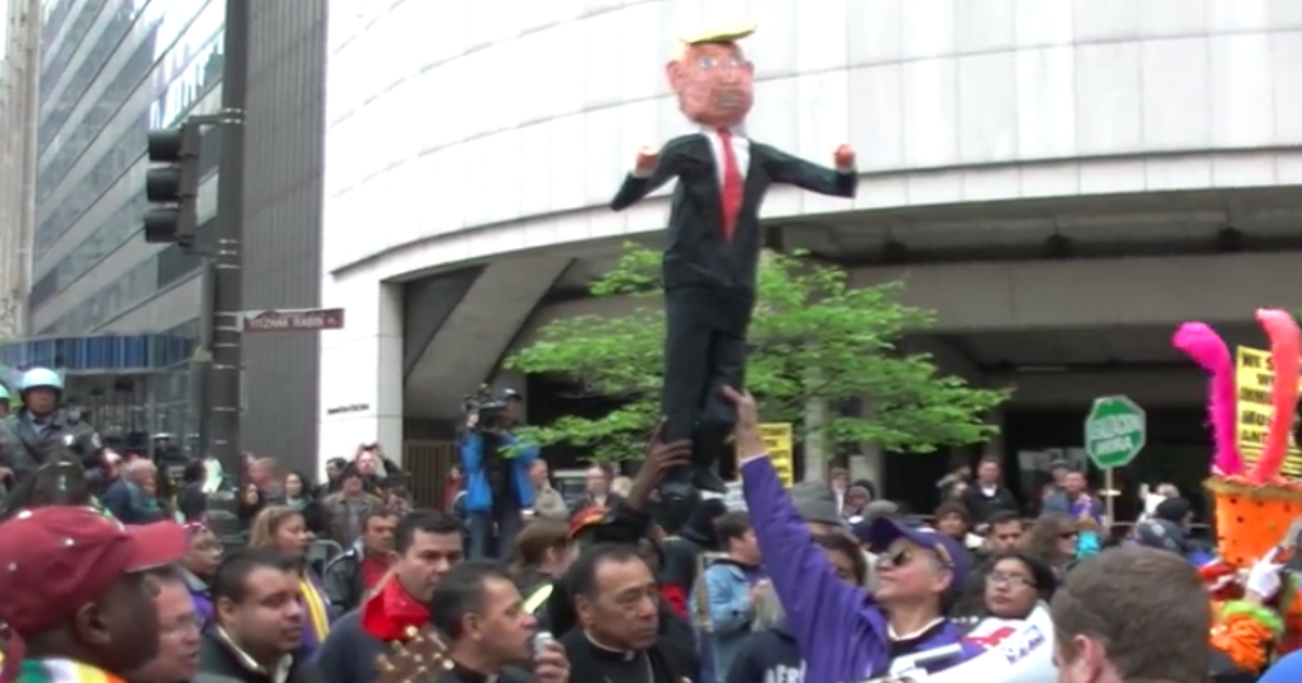 Chicago Pastor Performs Exorcism On Trump Effigy During May Day Demonstrations