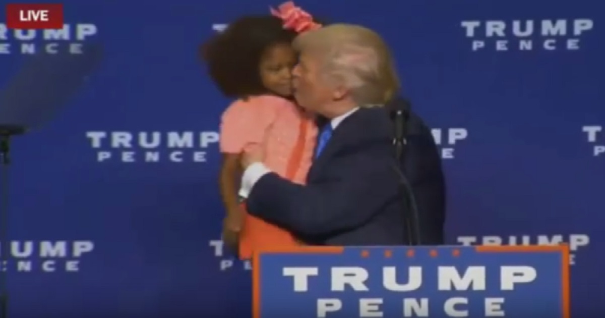 Creep Level Set to Max: Trump Tries to Kiss Little Girl on the Mouth At Rally & She Dodges It!