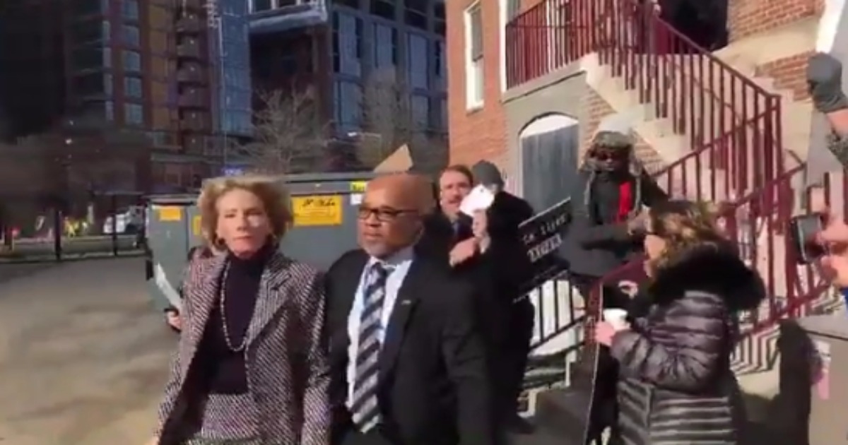 “Shame!”: Secretary of Education Betsy DeVos Blocked From Entering D.C. School By Protesters