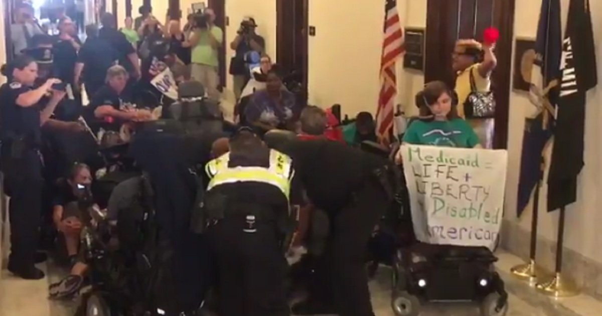 Disabled Americans Staging “Die-In” Outside of McConnell’s Office Dragged Out By Police